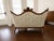 A stunning 19th-century Rococo Revival sofa from Genoa, Italy, with a richly carved walnut frame. The serpentine crest...