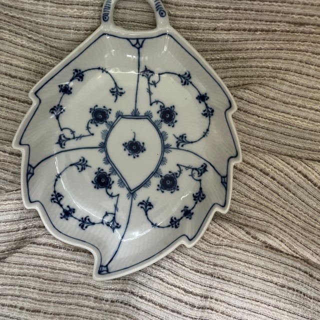 Presenting a fine porcelain antique Royal Copenhagen, leaf shaped serving dish in the blue fluted plain pattern number...