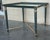 Mid Century Modern Coffee Table in Green Iron with Bronze and Brass Details Beautiful table with beveled frame and glass...