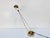 The elegant Meridiana halogen desk lamp—shown here in the rare gold-colored brass version—is an iconic postmodern design...