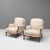 Pair of early 20th century French upholstered armchairs in beige fabric. Carved walnut show wood on cabriole legs. France...