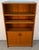 A beautifully crafted mid-century Danish modern bookcase in richly grained teak, offering the perfect balance of...