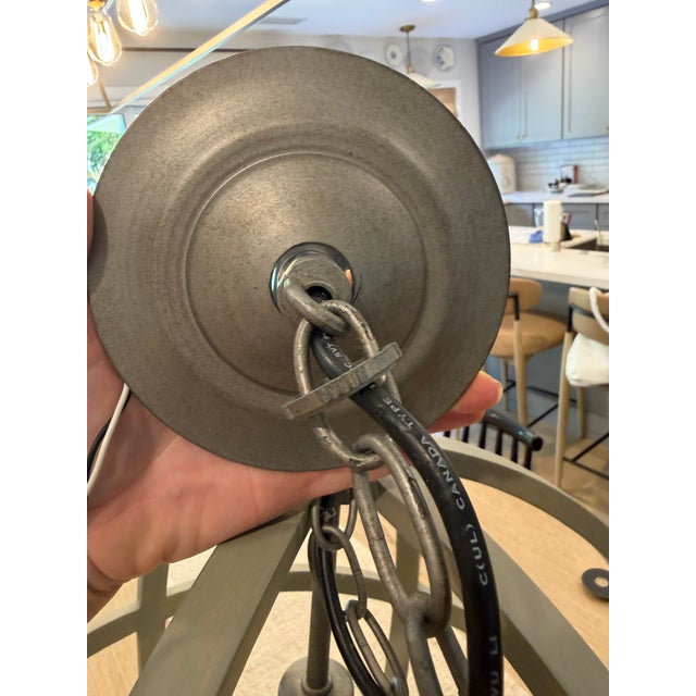 Discontinued Braden Grey Wood Pendant Light from Crate & Barrel, manufactured by Currey. A large sculptural orb pendant...