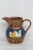 This wonderful small pitcher / creamer is made of ceramic. This piece features a gorgeous copper luster to the exterior...