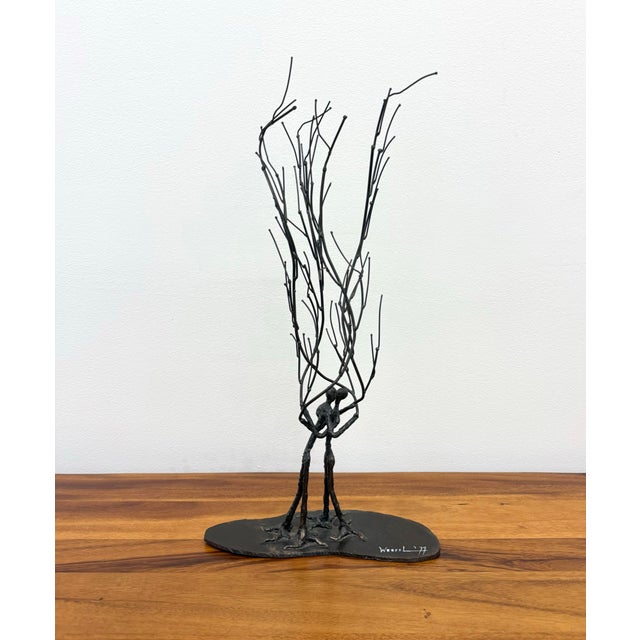 A compelling vintage welded metal sculpture signed and dated “Wessel ’79,” featuring an abstract embracing couple...