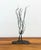 A compelling vintage welded metal sculpture signed and dated “Wessel ’79,” featuring an abstract embracing couple...