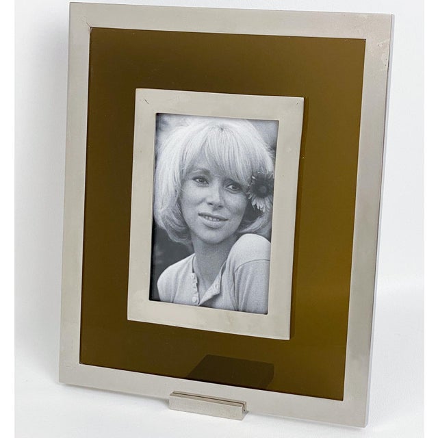 This stunning Mid-Century picture frame was crafted in Italy circa 1970. The rare easel-type table photo holder features a...