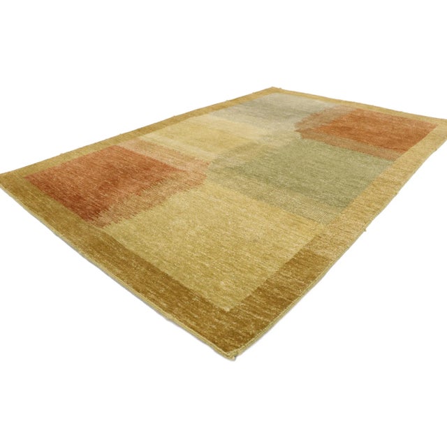 ​78018 Vintage Pakistani Rug, 04'00 x 006'02. Tendered in variegated shades of tan, olive, terra cotta, and brick red with...