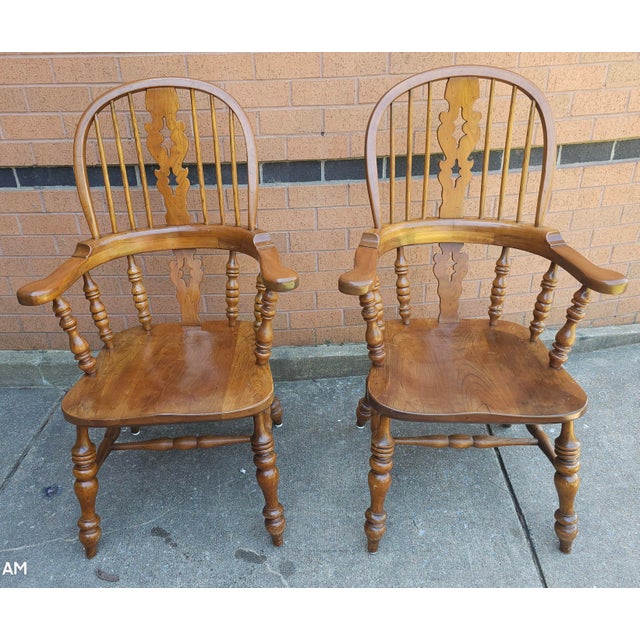 A pair Stickley Mid-Century Windsor Style Cherry Armchairs. Measures 26" in width, 23" in depth and stand 44" tall. Seat...