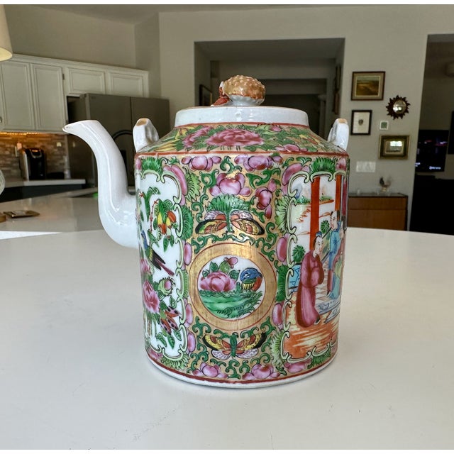 Chinese export canton famille rose porcelain lidded teapot from the 19th century (Qing Dynasty era). Featuring hand-...