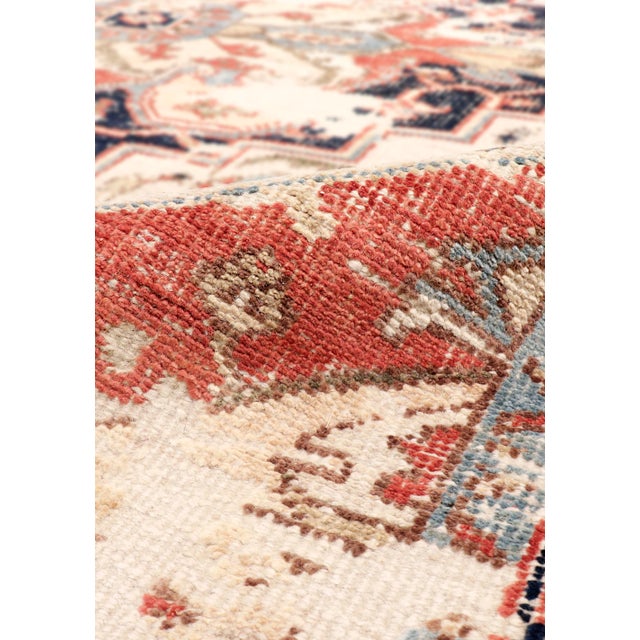 The Serapi Collection reinterprets traditional tribal geometric design through a refined palette. Each rug is hand-knotted...