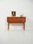 Scandinavian teak and oak entryway cabinet from the 1960s, featuring storage and drawers, recessed handles, and an...