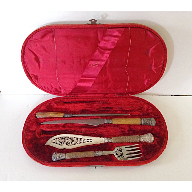 A Harrison Bros. & Howson cutlery set, that comes complete with a red velvet box. This set is unusual in that it also...