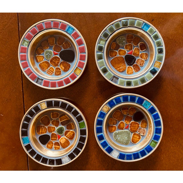 Set of four vintage Mid-Century Modern art mosaic tile coasters from Japan, measuring 3.75 inches in diameter. These round...