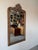 An elegant 19th-century French wall mirror featuring a richly carved giltwood frame in the Rococo taste. The stately...