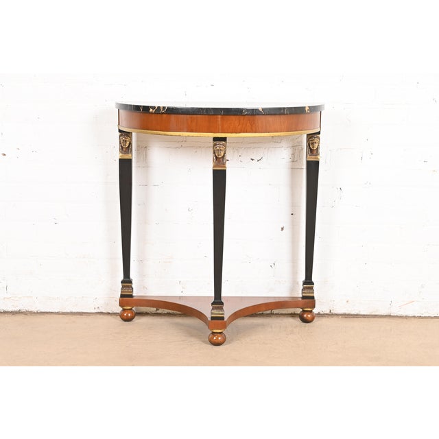 A gorgeous Empire or Neoclassical style demilune console or entry table By Fine Arts Furniture Co. and retailed by...