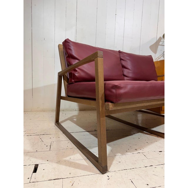 Compact Vintage Inspired Red Leather Sofa by Andy Thornton A beautifully characterful example of British craftsmanship,...