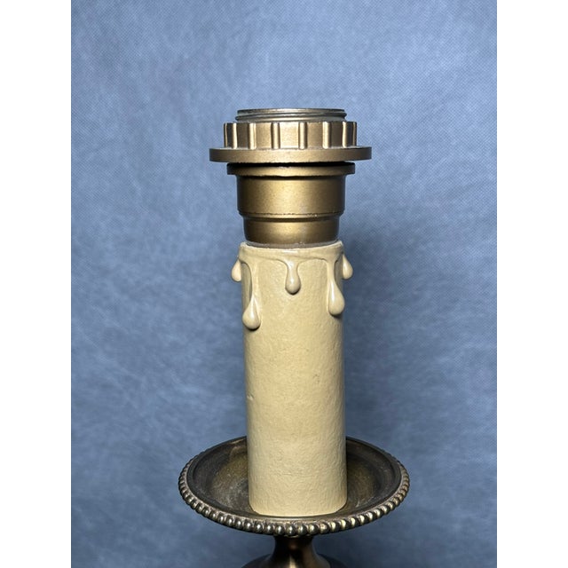 Decorative pair of vintage table lamps with fluted columns on square marble bases. The upper sections are designed to...