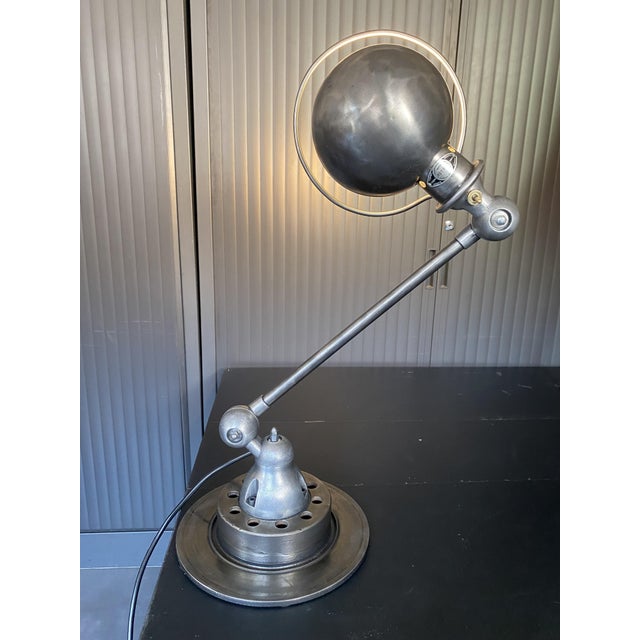 Authentic vintage Jieldé lamp with a 40cm arm Lamp completely stripped, brushed, and finished with a graphite patina Globe...
