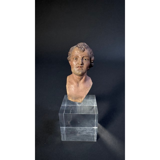 Neapolitan nativity scene puppet head from the late 18th century. This polychrome terracotta sculpture depicts the face of...