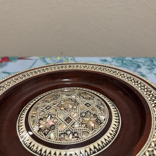 Elevate your home decor with this exquisite, handcrafted piece of Middle Eastern artistry. This vintage-style wooden plate...