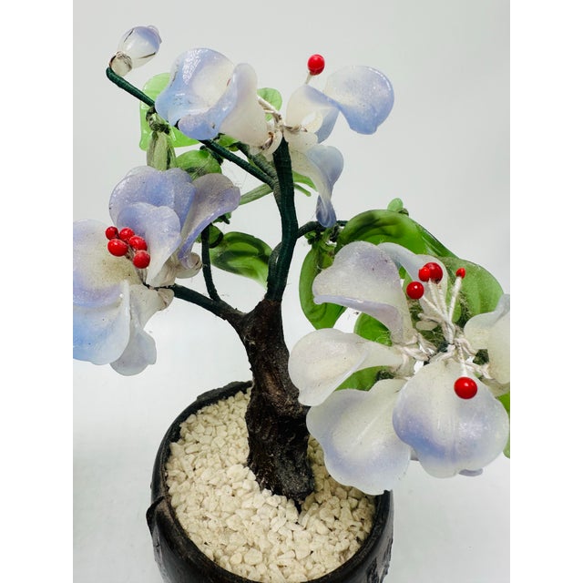 These are two delightful miniature decorative potted flower trees, crafted with intricate attention to detail. The flowers...