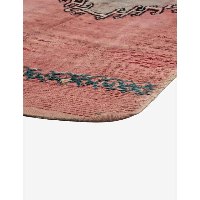 Vintage Pink Moroccan Rug – Handmade Tribal Berber Wool Rug This beautiful vintage Moroccan rug features a soft faded pink...