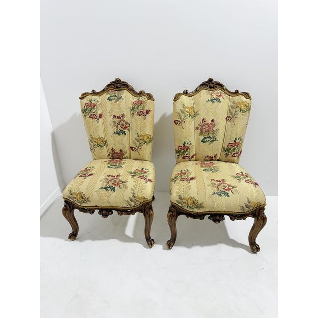 Set of two small Louis XV-style armchairs in carved curved wood and floral fabric, 1940s Intact and in good condition,...