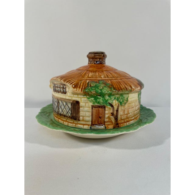 An adorable English made ceramic Beswick Cottage Ware Butter or Cheese Dish. Circa 1930s-1950s. Maker's stamp on both...