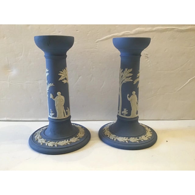 Enhance your décor with this elegant Pair of Vintage Wedgwood Jasperware Candlesticks featuring the iconic blue jasper...