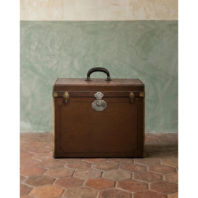 Charming brown vintage canvas cube-shaped trunk from the 1920s, believed to be a hat trunk.this decorative trunk boasts...