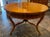 This 19th century German walnut Biedermeier center table is a timeless piece of antique furniture that exudes elegance and...