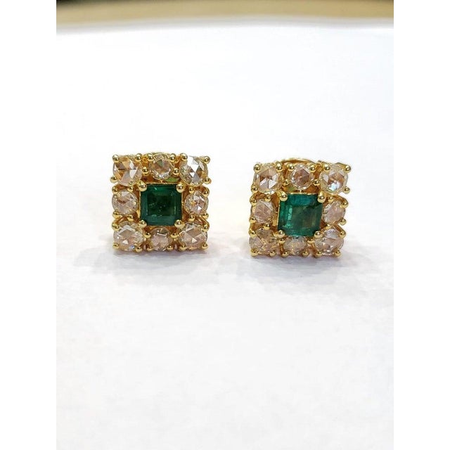 A very chic and wearable, Emerald Stud Earrings set in 18K Yellow Gold & Diamonds. The weight of the square Emeralds are...