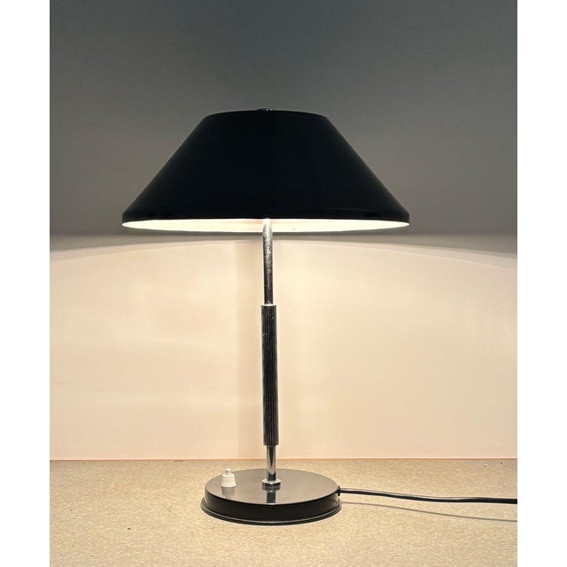Nice, timeless desk or table lamp, (in style of) Jo Hammerborg for Fog & Morup, 1960s. Black metal shade and base. In a...