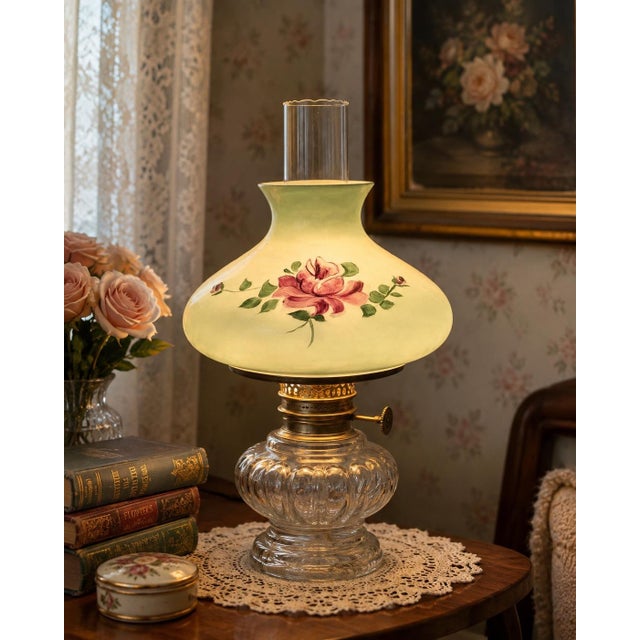 Charming mid-20th-century glass lamp shade featuring a softly luminous pale green finish and delicate hand-painted rose...