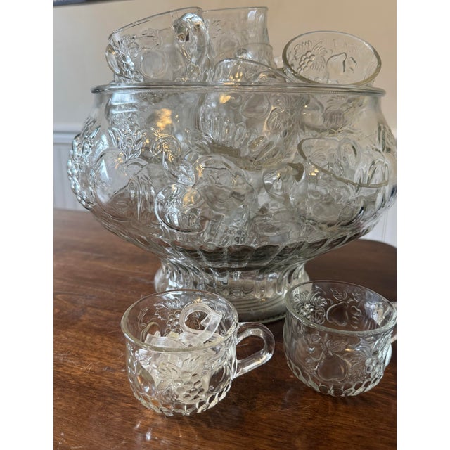 This is a set of a punch bowl, 24 cups, and nine hooks that would be an elegant touch to your event or gathering this...
