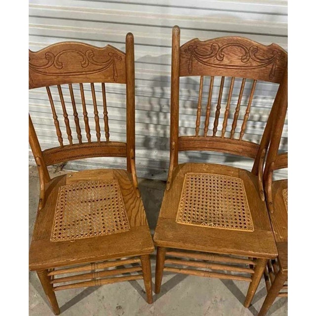 These Early American cane side chairs combine timeless colonial charm with sturdy craftsmanship, featuring a warm wood...
