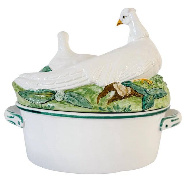 Vintage hand-painted Italian majolica covered serving dish. The lid features two sculpted nesting doves resting among...
