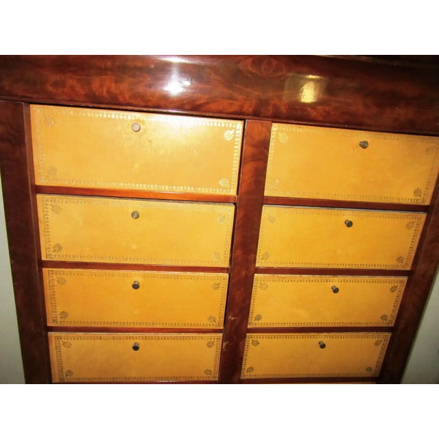 Antique French crotch mahogany and leather cartonnier (meaning cabinet with compartments). Made in France during the...