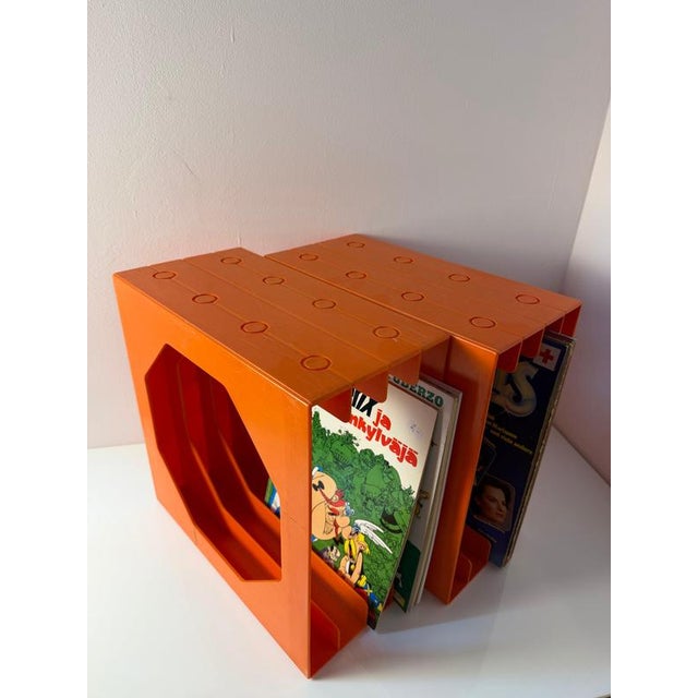 A true 70s pop art classic: This vibrant orange record stand from Schweizer Design is an iconic tribute to your vinyl...