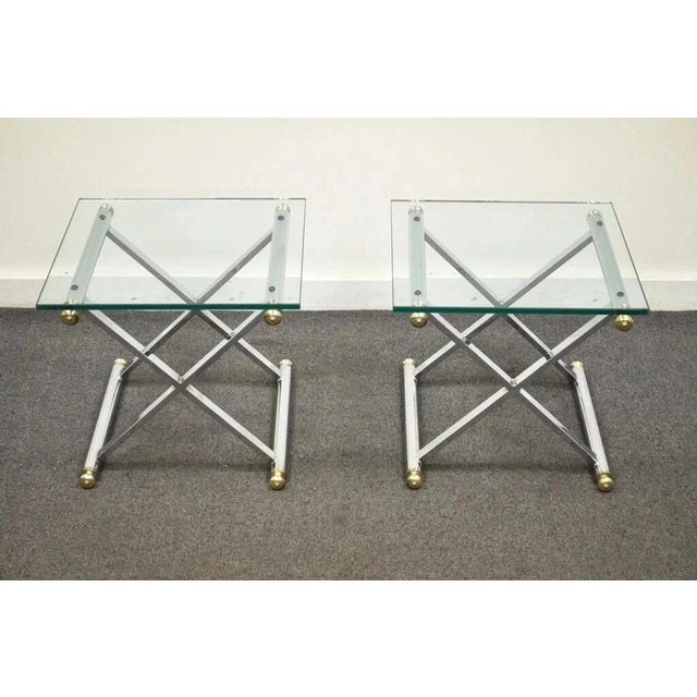 Vintage Mid Century Modern Hollywood Regency Chrome Brass Glass X Form Side Tables - a Pair. Item features an X-form...
