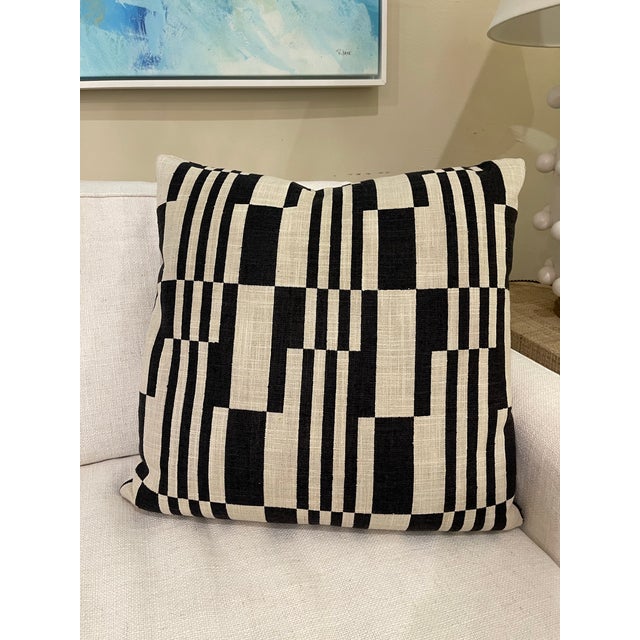 Add a touch of musical sophistication to your decor with this striking black and cream decorative pillow. Featuring a...