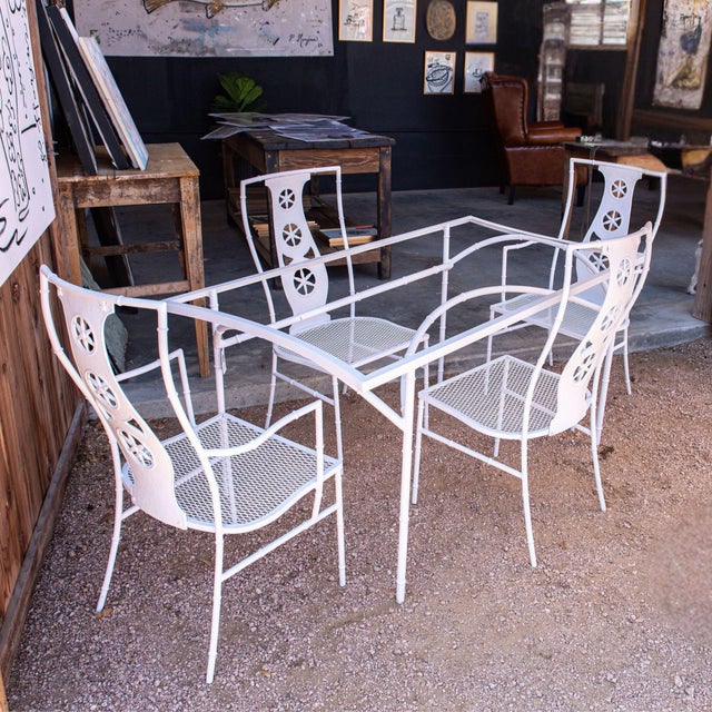 Set of four Salterini “Montego” dining chairs featuring the iconic pinwheel back design associated with the line. The...