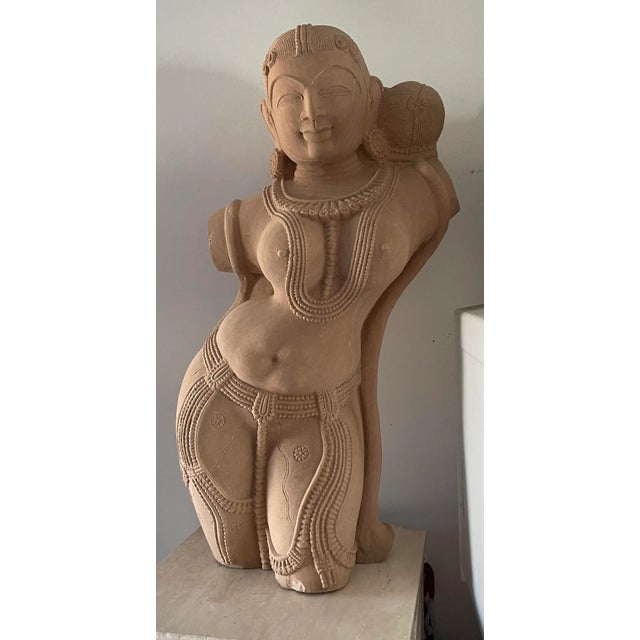 This beautiful sculpture weights approx 70 lbs it is heavy. The detail in the sandstone is amazing and definetly a...