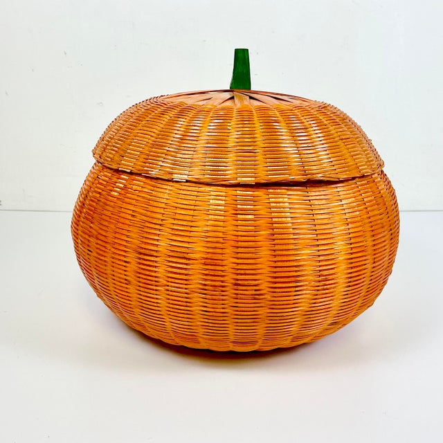 This is a large wicker pumpkin basket. The basket is covered and dyed a pumpkin orange with a small wood stem. Perfect for...