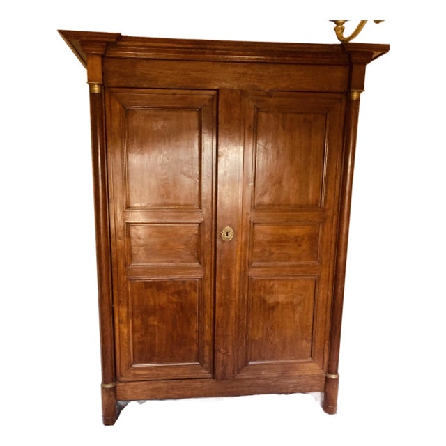 Antique French Empire Armoire Walnut, Columns to Either Side Front With Bronze Gilt Mounts Also Gilt Bronze Key Hole For Sale
