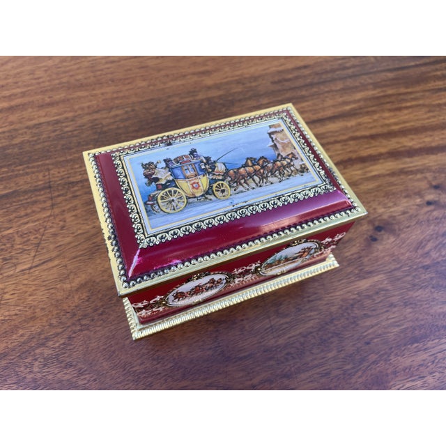 Made by Klann in Soviet Western Germany. A brass finished tin container with deep and rich red overlay. Embossed patterns...