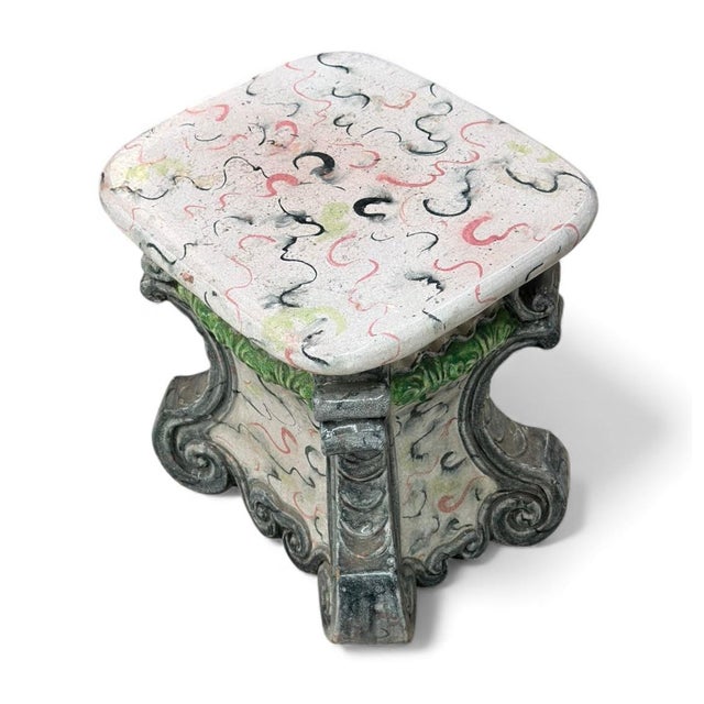 This is a whimsical ceramic piece that functions perfectly as a garden stool, accent table, or small pedestal. Its blend...