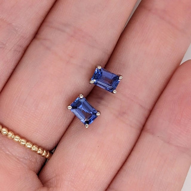 Gorgeous blue Tanzanite with a tinge of purple, these minimalist stud earrings are a great daily look! Available in solid...