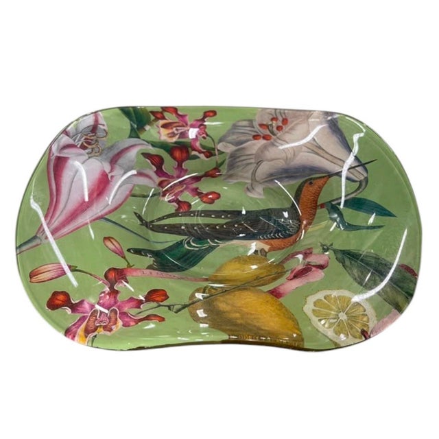 Bring a touch of lush, tropical elegance into your home with this striking vintage reverse-decoupage glass dish. Crafted...